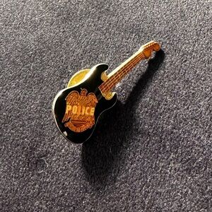 “The Police” vintage black and gold tones guitar pin